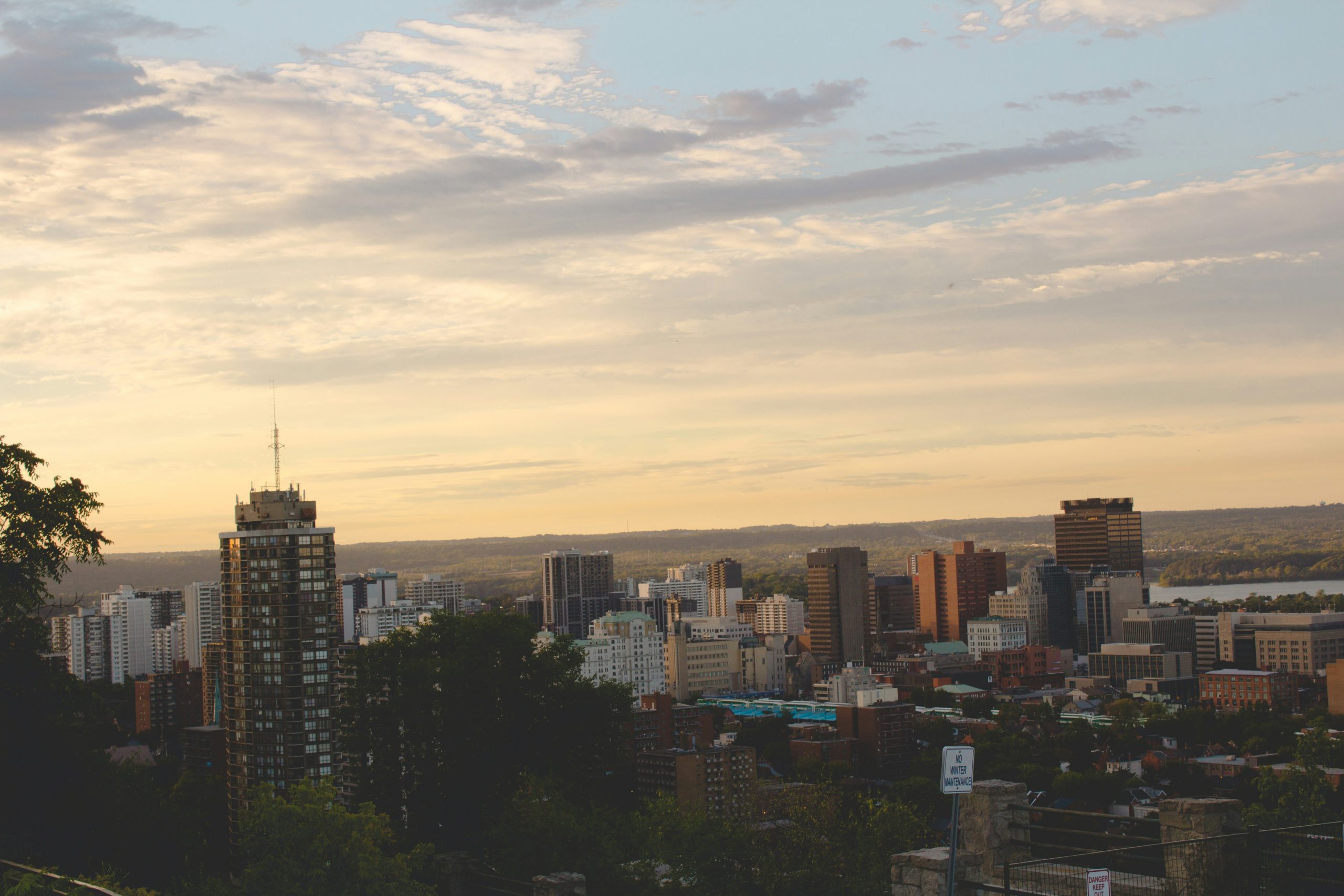 Hamilton skyline at sunset symbolizing protection, transparency, and trust in leadership.